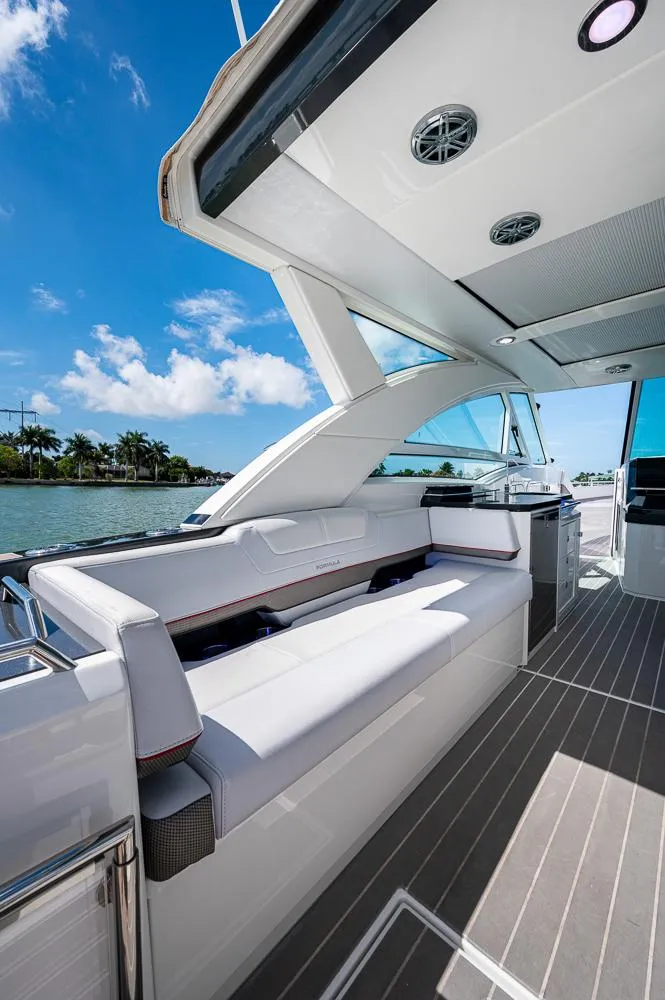 Slide: The Image of 2019 Formula 430 Super Sport Crossover yacht with sleek seating and modern design. - 22