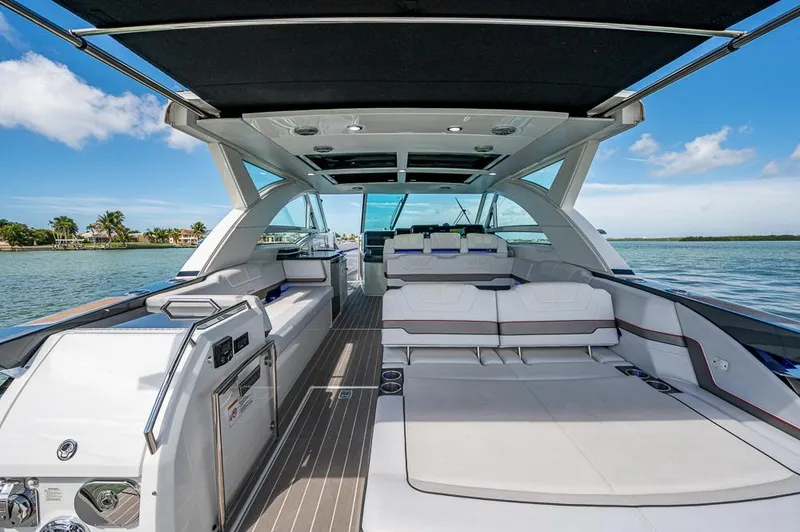 Slide: The Image of 2019 Formula 430 Super Sport Crossover yacht interior with spacious seating and scenic water view. - 26
