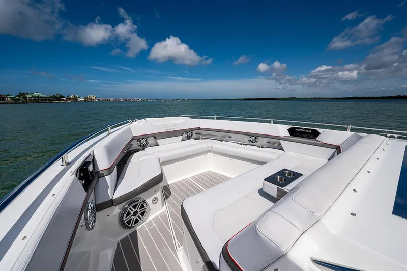 Slide: The Image of 2019 Formula 430 Super Sport Crossover boat interior with luxurious seating on a sunny day. - 3