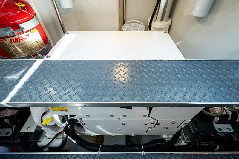 Slide: The Image of Engine compartment of 2019 Formula 430 Super Sport Crossover with fire extinguisher and metal flooring. - 39