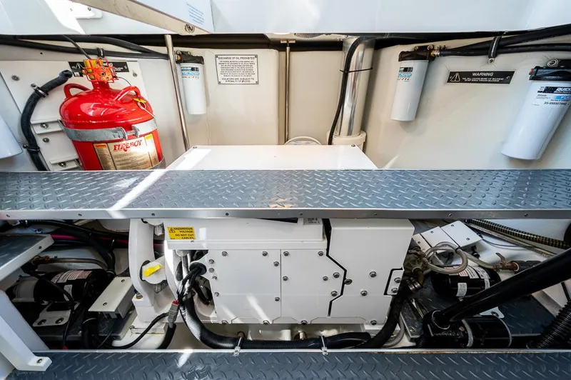 Slide: The Image of Engine compartment of a 2019 Formula 430 Super Sport Crossover with fire extinguisher and filters. - 40