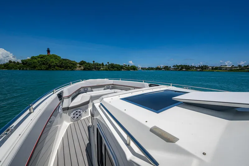 Slide: The Image of 2019 Formula 430 Super Sport Crossover cruising on clear blue waters near a lush island. - 42