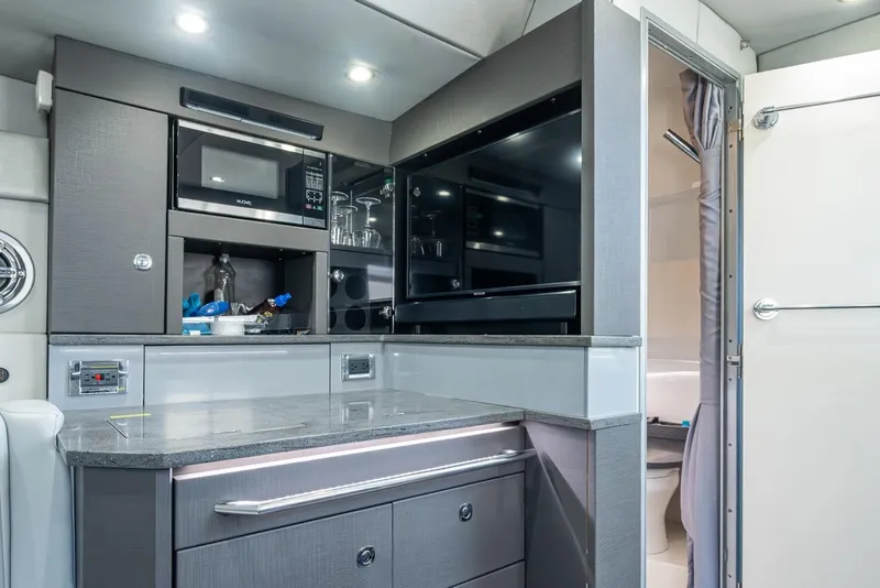 Slide: The Image of 2019 Formula 430 Super Sport Crossover interior kitchen with modern appliances. - 49