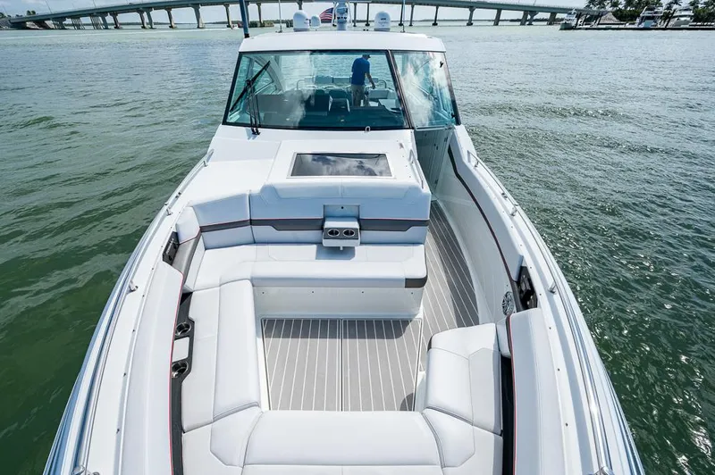 Slide: The Image of 2019 Formula 430 Super Sport Crossover boat with spacious seating on open water. - 5