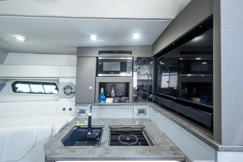 Slide: The Image of Luxurious interior of 2019 Formula 430 Super Sport Crossover yacht kitchen area. - 50