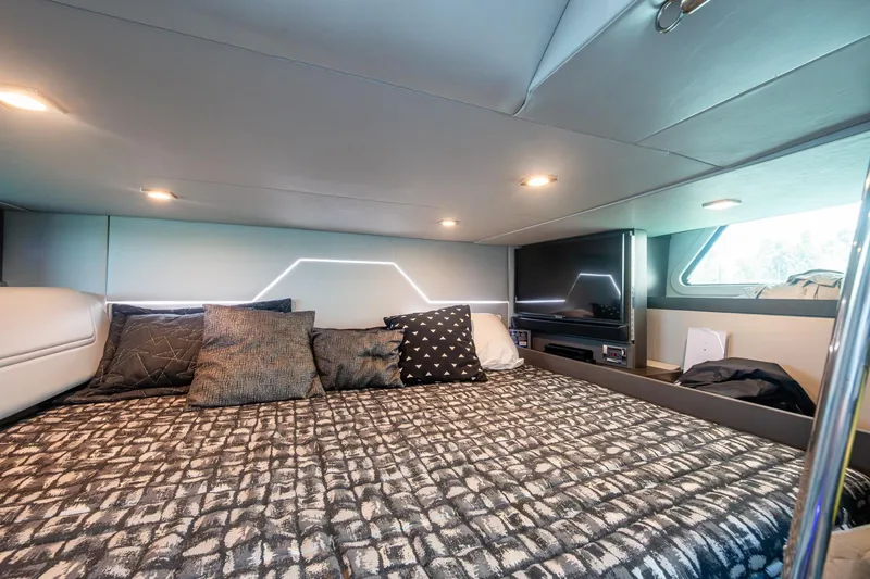 Slide: The Image of Luxurious cabin interior of 2019 Formula 430 Super Sport Crossover with cozy bedding and modern lighting. - 55