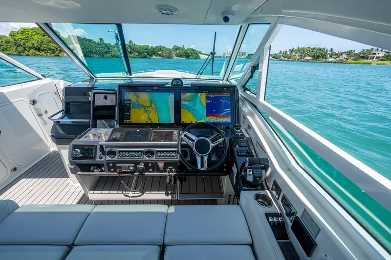 Slide: The Image of 2019 Formula 430 Super Sport Crossover helm with advanced navigation displays on open water. - 65