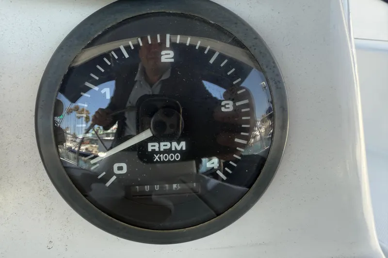 Slide: The Image of Close-up of RPM gauge on 1998 Hunter 34 boat dashboard. - 16
