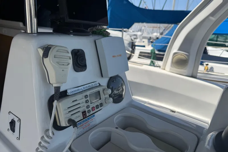Slide: The Image of Control panel of a 1998 Hunter 34 sailboat with radio and microphone. - 17