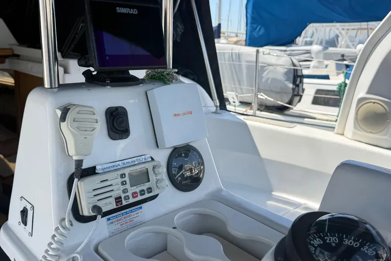 Slide: The Image of Cockpit of 1998 Hunter 34 sailboat with navigation equipment and compass. - 4