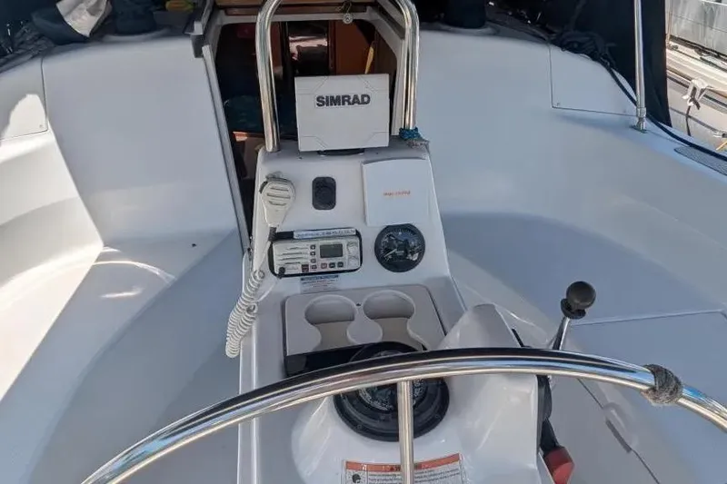 Slide: The Image of Cockpit of 1998 Hunter 34 sailboat with navigation equipment and steering wheel. - 5