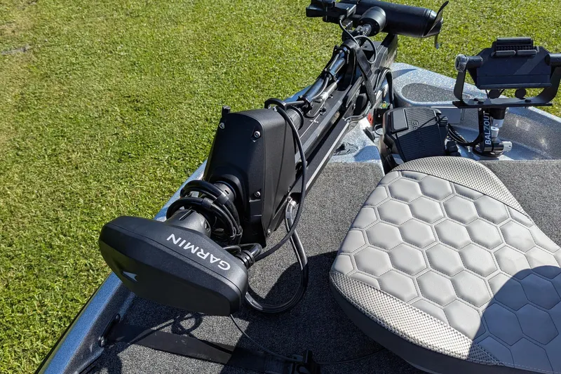 Slide: The Image of 2026 Bass Cat Cougar FTD SP boat with Garmin equipment on deck. - 11