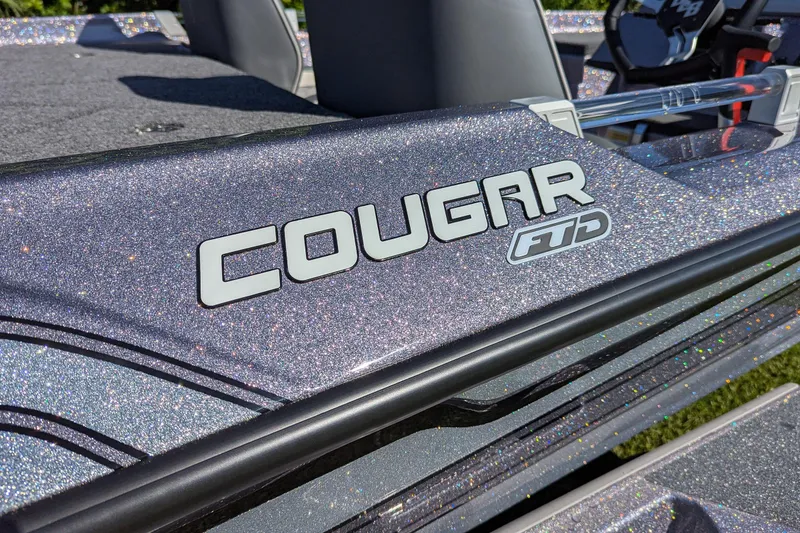 Slide: The Image of 2026 Bass Cat Cougar FTD SP boat with glittery finish and logo detail. - 5