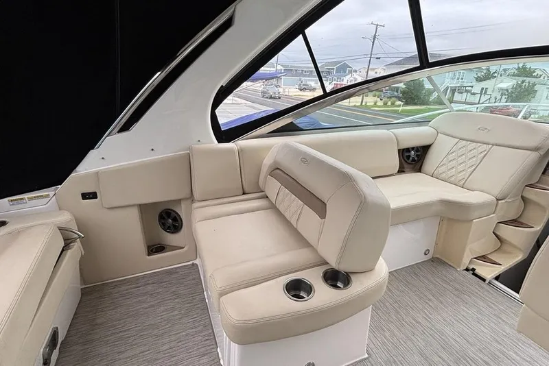 Slide: The Image of Luxurious interior of 2019 Regal 33 XO boat with beige seating and modern design. - 7