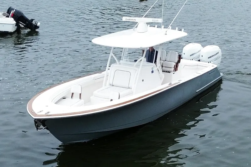 Slide: The Image of 2021 Valhalla Boatworks V-33 in water, featuring dual Mercury engines. - 1