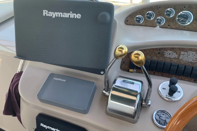 Slide: The Image of Control panel of a 2001 Sea Ray 340 Sundancer with Raymarine equipment. - 12