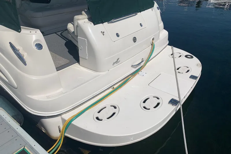 Slide: The Image of 2001 Sea Ray 340 Sundancer boat stern with swim platform and mooring lines. - 28
