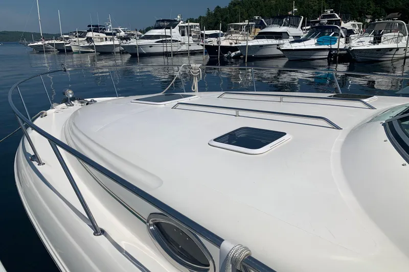 Slide: The Image of 2001 Sea Ray 340 Sundancer yacht docked at marina with other boats. - 31