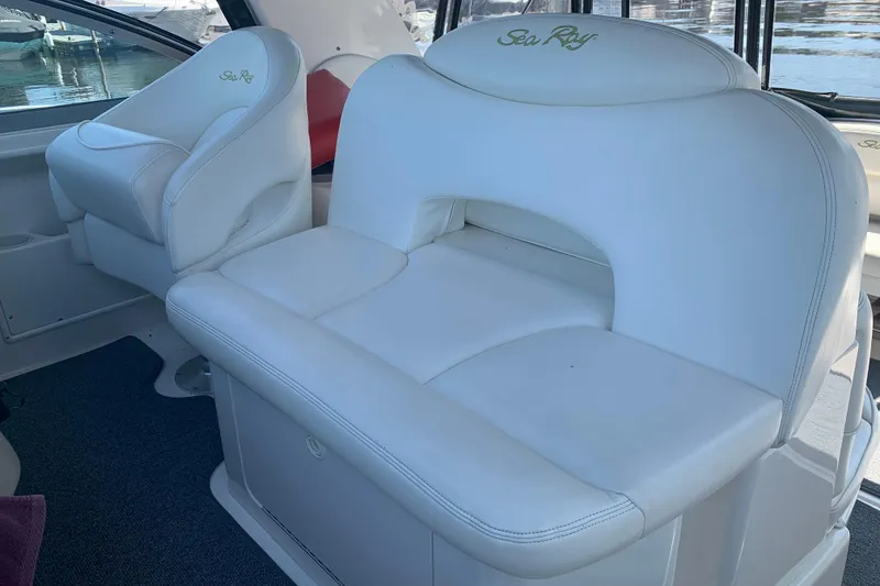 Slide: The Image of White leather seating on a 2001 Sea Ray 340 Sundancer boat interior. - 8