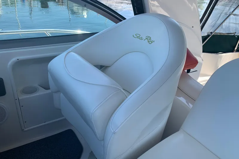 Slide: The Image of White leather seat on 2001 Sea Ray 340 Sundancer boat interior. - 9