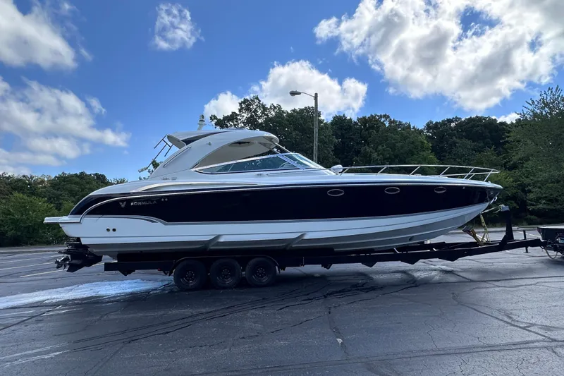Slide: The Image of Control panel of a 2008 Formula 400 Super Sport boat with Garmin and Lewmar controls. - 11