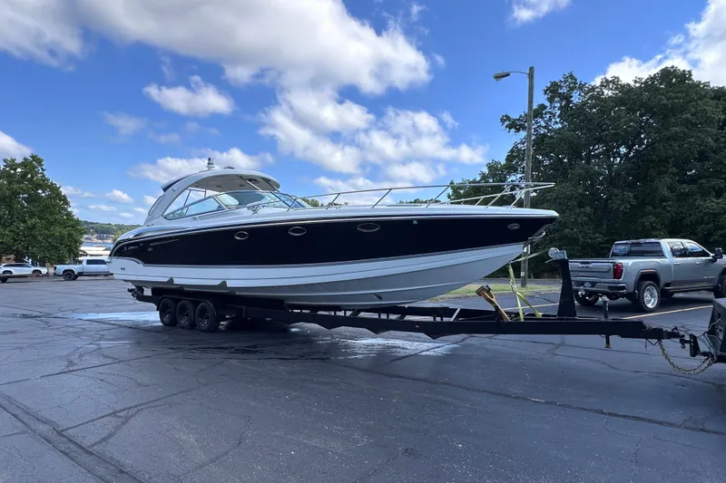 Slide: The Image of 2008 Formula 400 Super Sport boat stern with dual propellers in a garage setting. - 14