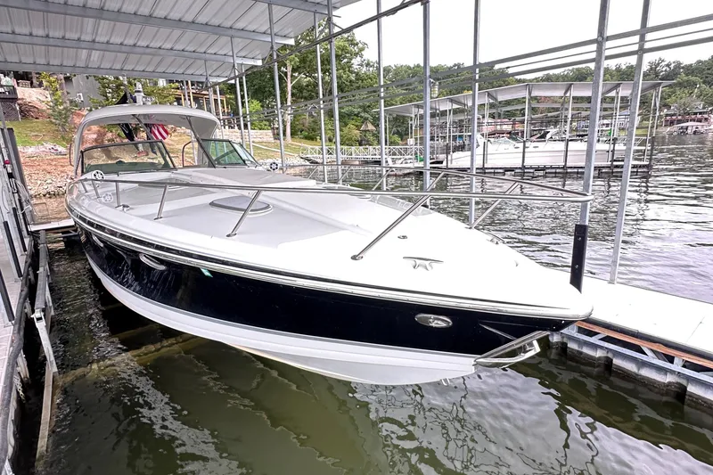 Slide: The Image of 2008 Formula 400 Super Sport boat with dual propellers in a garage setting. - 15