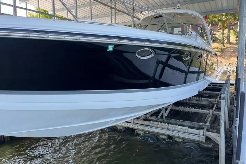 Slide: The Image of 2008 Formula 400 Super Sport yacht interior with beige seating and wood flooring. - 17