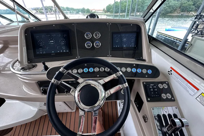 Slide: The Image of 2008 Formula 400 Super Sport boat on trailer, parked outdoors under a blue sky. - 2