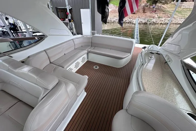 Slide: The Image of Interior of a 2008 Formula 400 Super Sport yacht with wood flooring and beige seating. - 21