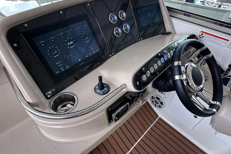 Slide: The Image of 2008 Formula 400 Super Sport boat on trailer, parked outdoors under blue sky. - 3