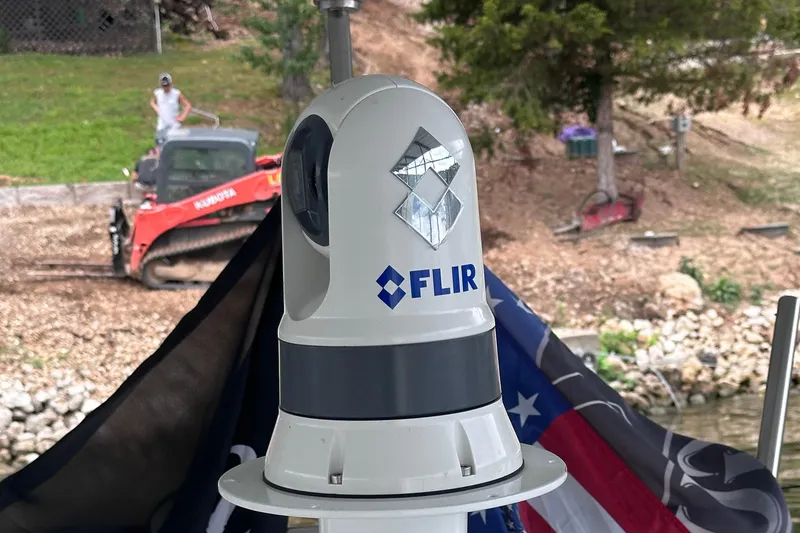 Slide: The Image of 2008 Formula 400 Super Sport boat on trailer under blue sky. - 5