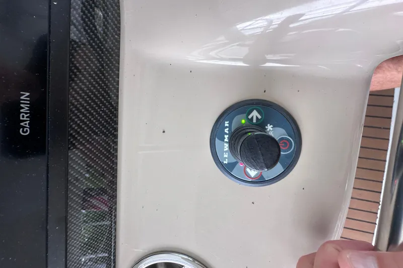 Slide: The Image of 2008 Formula 400 Super Sport boat dashboard with steering wheel and navigation screens. - 7