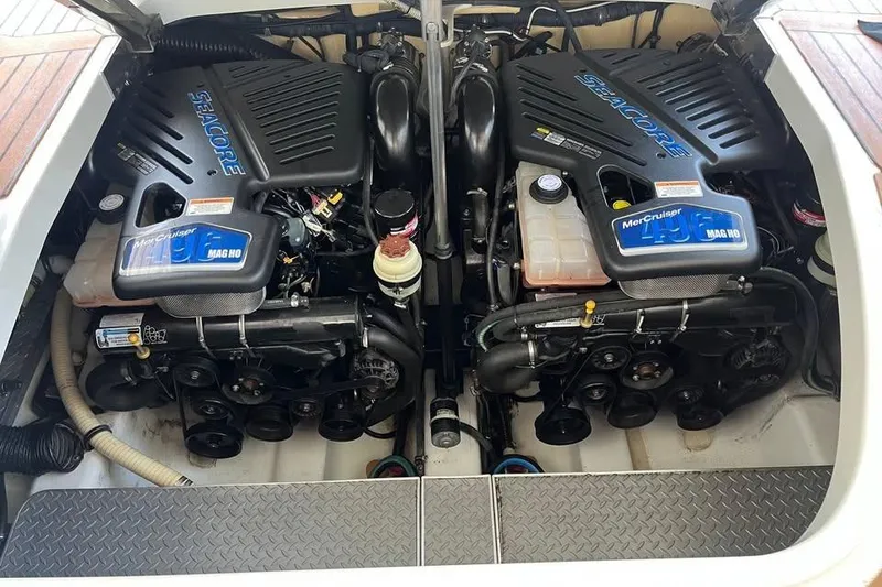 Slide: The Image of Control panel of a 2008 Formula 400 Super Sport boat with throttle levers and caution labels. - 9