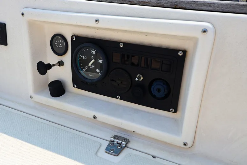 Slide: The Image of Control panel of 1985 Island Packed 31 yacht with gauges and switches. - 10