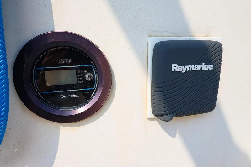 Slide: The Image of Depth gauge and Raymarine device on 1985 Island Packed 31 yacht. - 11