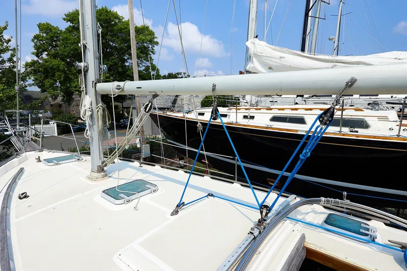 Slide: The Image of 1985 Island Packed Yachts Island Packed 31 sailboat deck with rigging and mast. - 6
