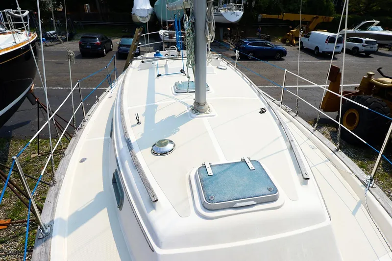 Slide: The Image of 1985 Island Packed Yachts Island Packed 31 sailboat deck view in a marina. - 4