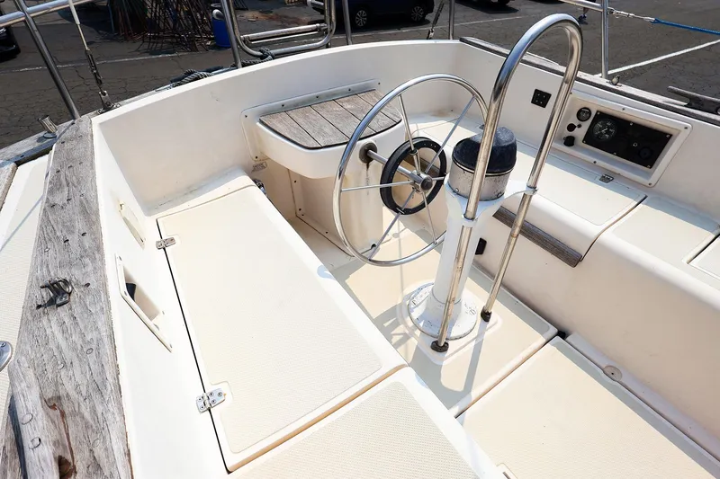 Slide: The Image of Cockpit of 1985 Island Packed 31 yacht with steering wheel and control panel. - 5