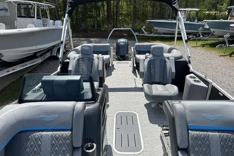 Slide: The Image of 2025 Bennington 22M pontoon boat interior with luxurious seating and modern design. - 5
