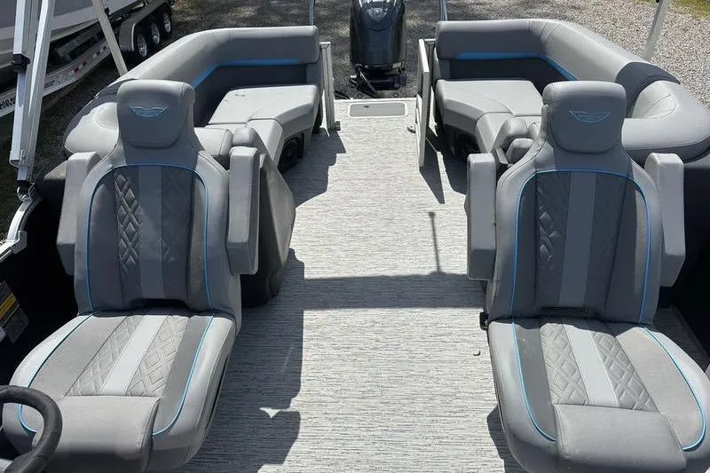 Slide: The Image of 2025 Bennington 22M boat interior with gray seating and modern design. - 7