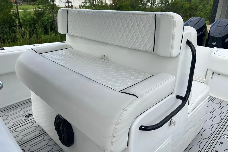 Slide: The Image of 2022 SeaHunter 33 Tournament boat with white cushioned seating and black accents. - 7