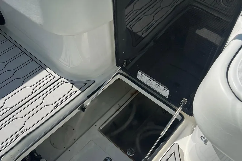 Slide: The Image of 2022 SeaHunter 33 Tournament boat storage compartment with open hatch and deck view. - 9