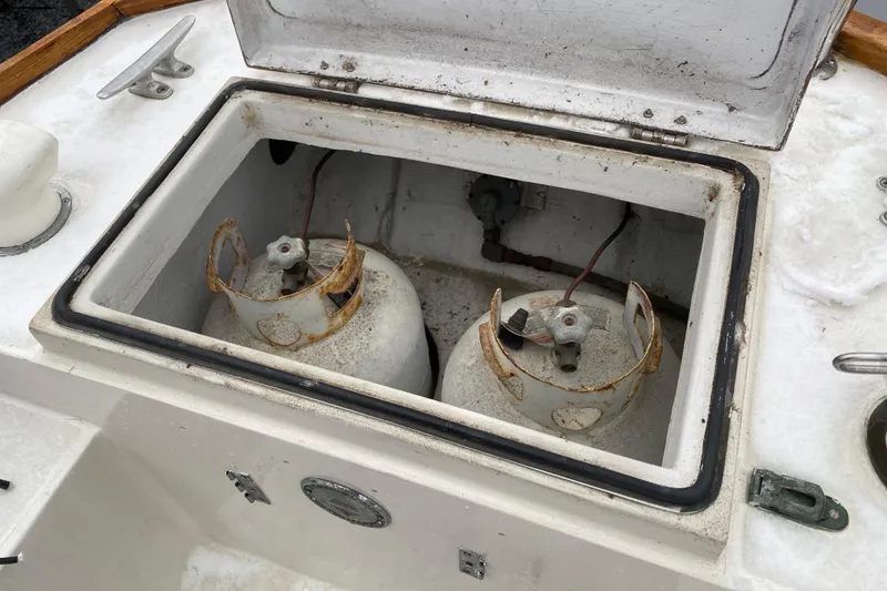 Slide: The Image of Open storage compartment on 1972 Bristol 40 boat with two propane tanks. - 11