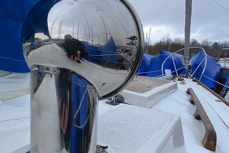 Slide: The Image of 1972 Bristol 40 sailboat deck with polished metal and blue covers. - 20