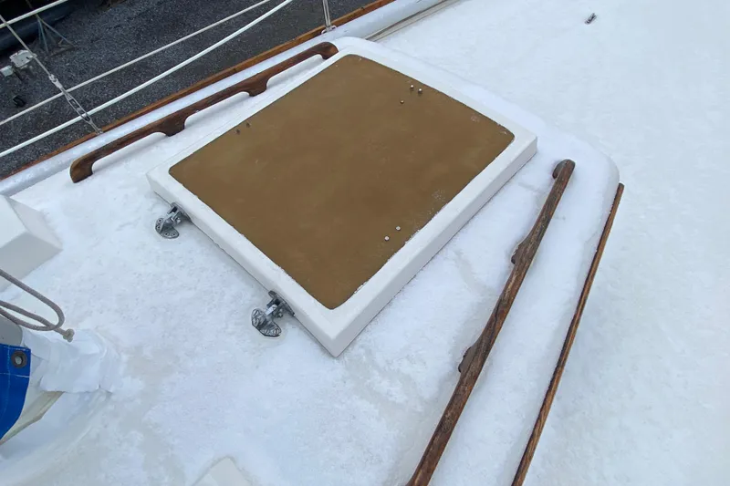 Slide: The Image of 1972 Bristol 40 boat deck with wooden handrails and hatch. - 21