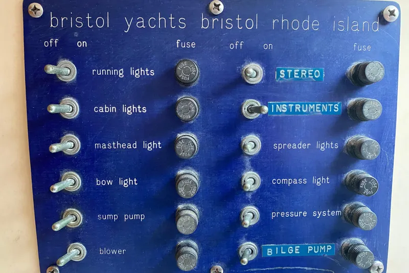 Slide: The Image of Control panel of a 1972 Bristol 40 yacht with labeled switches and fuses. - 37