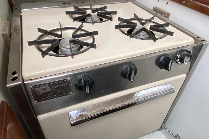 Slide: The Image of Vintage 1972 Shipmate stove with four burners in a Bristol 40 yacht kitchen. - 44