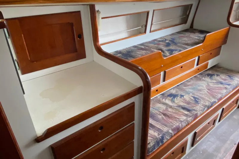 Slide: The Image of 1972 Bristol 40 interior with wooden cabinetry and patterned upholstery. - 51