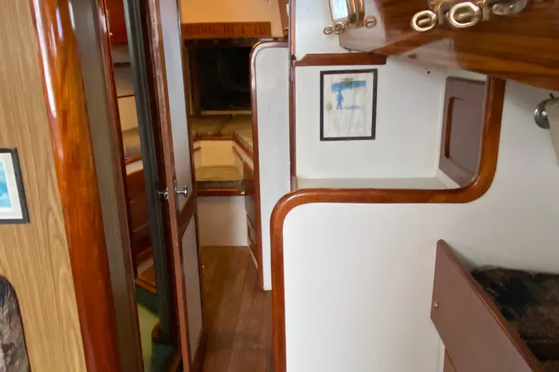 Slide: The Image of Interior of a 1972 Bristol 40 sailboat, featuring wooden finishes and cozy cabin spaces. - 52
